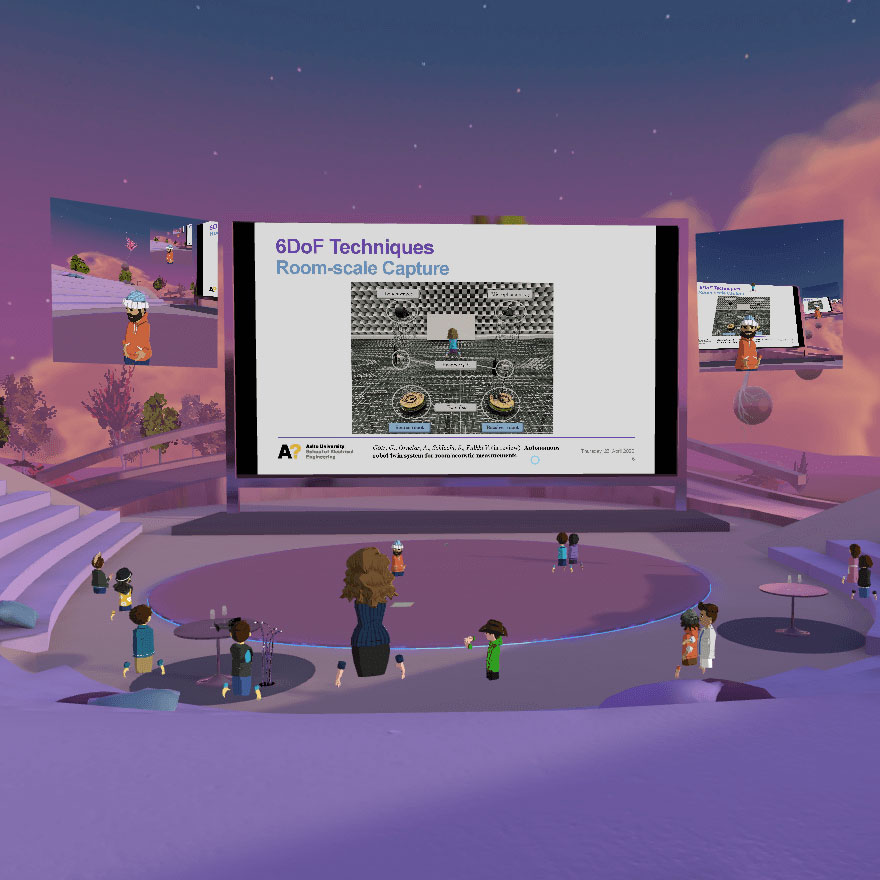 A screenshot of Match XR 2020 event at the VR Pavilion Finland virtual venue. One big screen and two smaller screens are used for presenting and virtual avatars are watching. The "evening sun" has coloured everything purple.