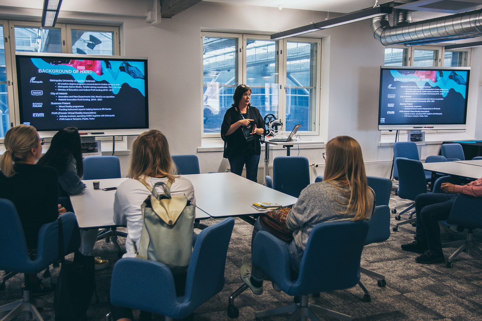 Helsinki XR Center's project manager Tiina Vuorio telling visitors about the Helsinki XR Center.