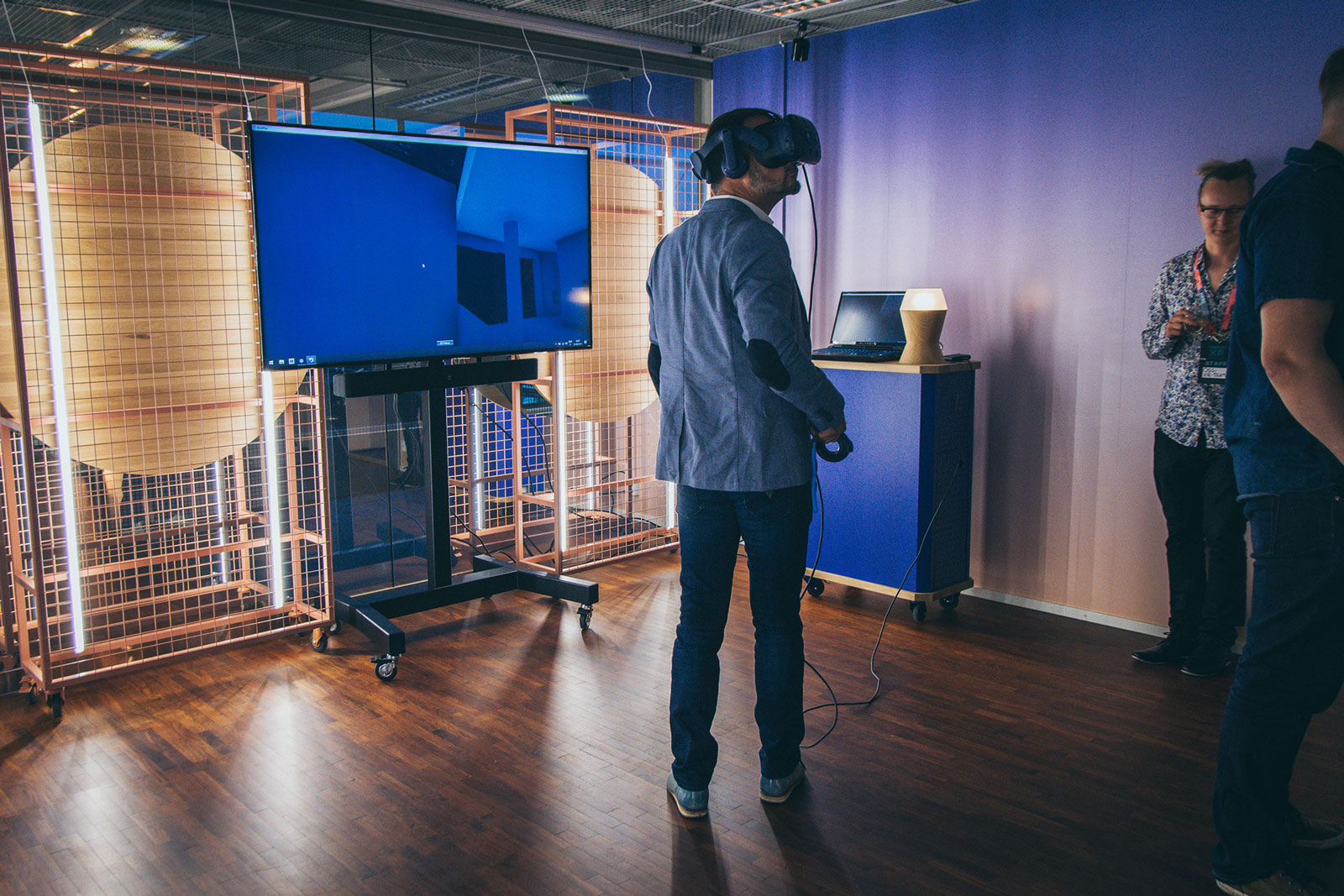 Man standing in XR Showroom wearing virtual reality headset.