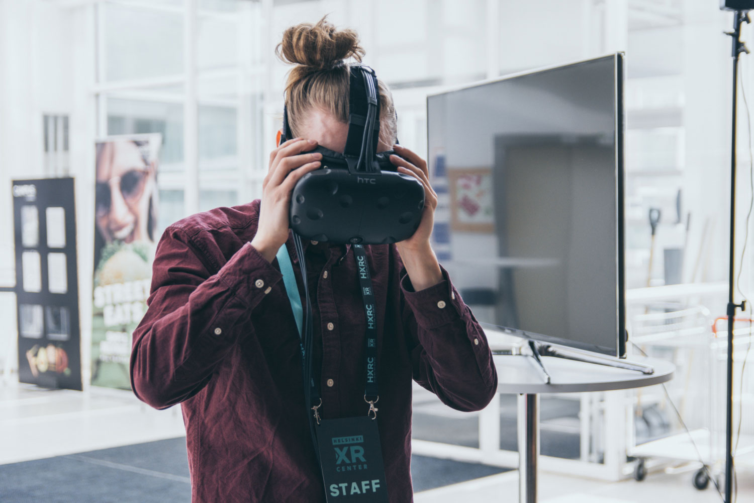 A person taking off his virtual reality glasses.