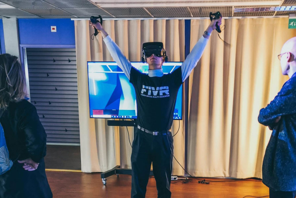 A man with VR headset looking up.