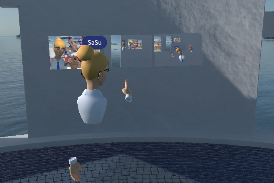 A screenshot of Glue Platform in use. One participant is pointing at screenshot pictures on the wall.