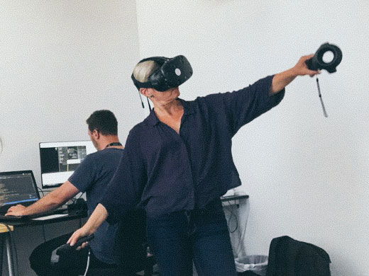 Person in a VR headset doing a powerful motion.