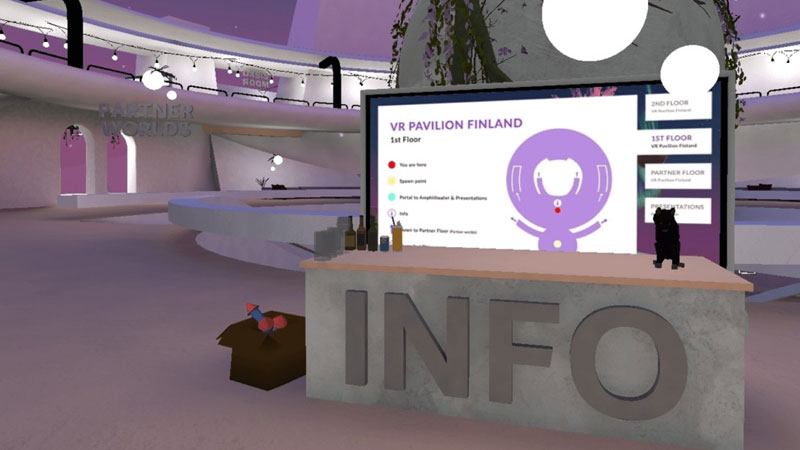 AltspaceVR screenshot. Information desk with a screen behind.
