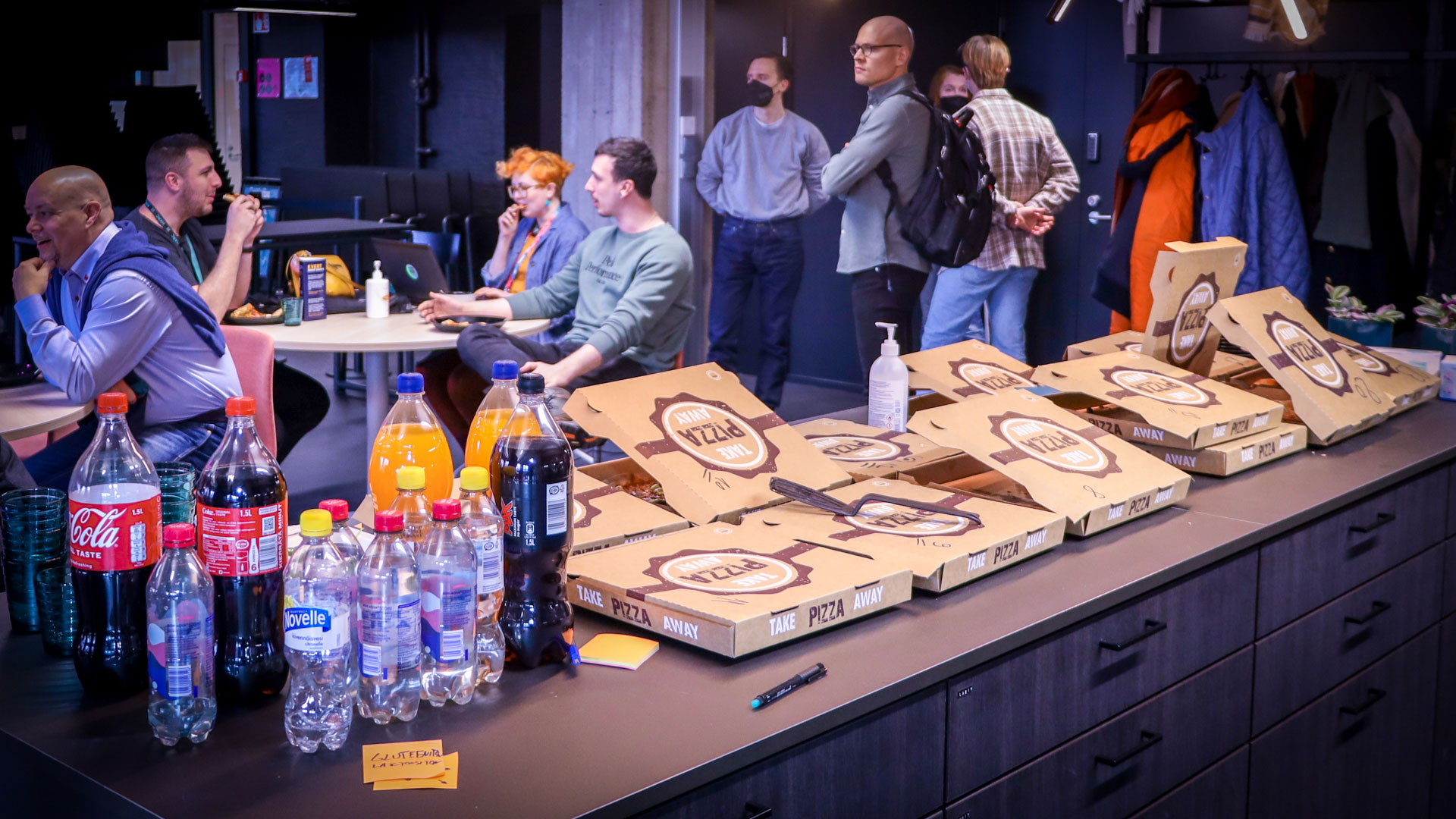Pizza and drinks on a table at a HXRC Afterwork event